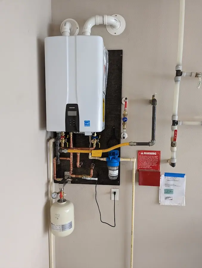 Professional plumber installing copper piping in a Taylor Creek home